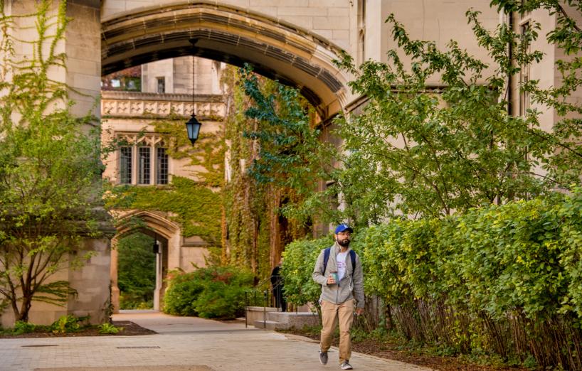 Student Walking Through Archway