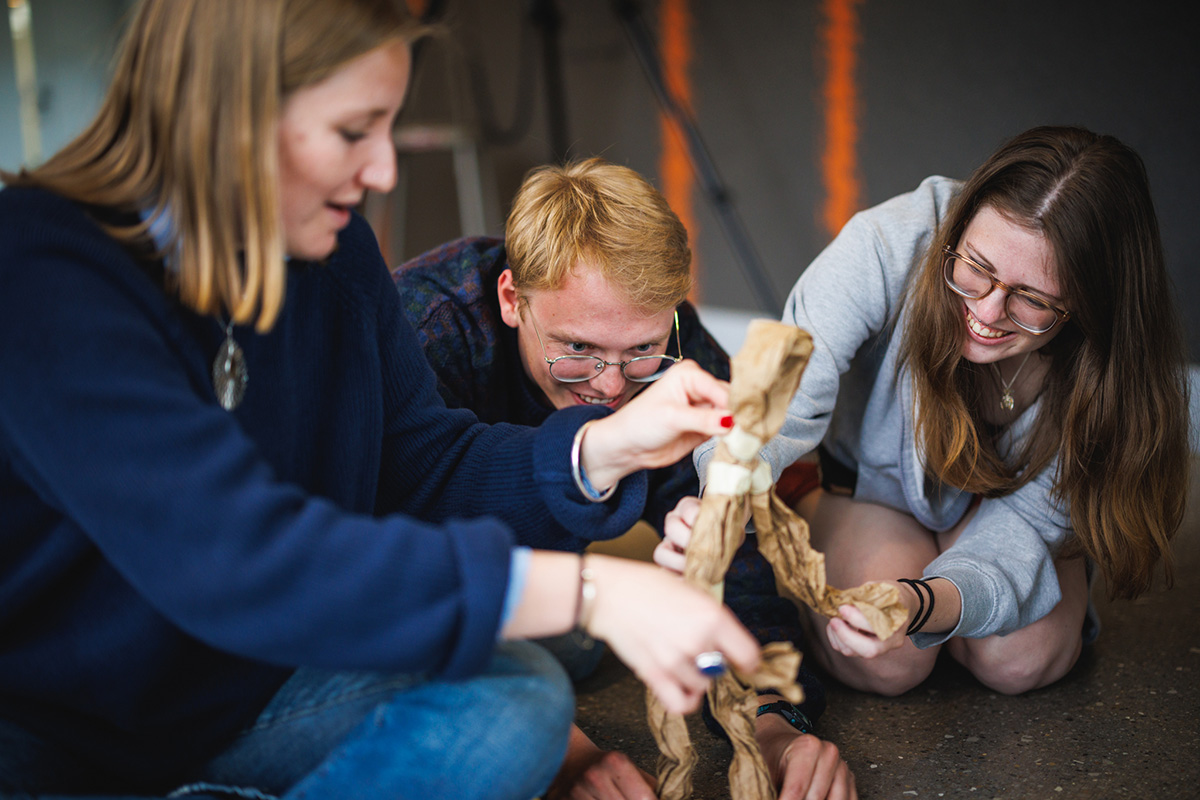 In Sensory Studies, an undergraduate seminar taught by Professor Michele Friedner in the Department of Comparative Human Development, Eva Youel Page, Grace Brown, and Owen Castle participate in a tabletop puppetry and sensory theater workshop.